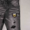 jean gris para niño con parches y rotos urbanos