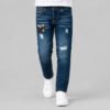 jean-azul-oscuro-parches-rotos-nino jeans azul oscuro corte slim con estilo urbano por sus parches y rotos, disponible para niño en Impacto urban